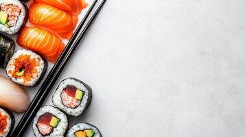 Elegant Dinner Concept with Assorted Sushi Rolls and Sashimi on Minimalistic White Background photo