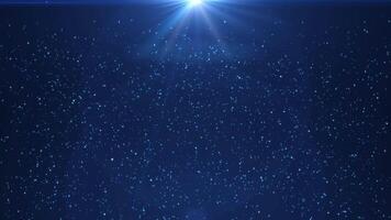 Abstract blue digital background. A stream of shiny particles, a glowing beautiful rain of dust particles and bokeh on a blue background video