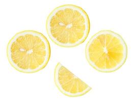 Top view set of fresh yellow lemon fruit in halves and slices or quarter scattering isolated on white background with clipping path photo