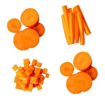 Top view set of orange carrot slices or pieces in circle stick and cube shapes in stacks isolated on white background with clipping path photo
