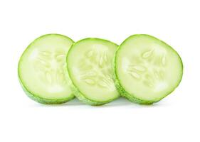Side view of fresh green cucumber slices in circle shape in stack isolated on white background with clipping path photo