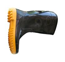 Side view of one side of black gumboot or black boot for working in garden isolated on white background with clipping path photo