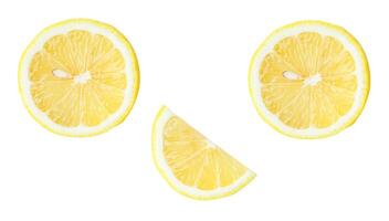 Top view set of fresh yellow lemon fruit in halves and slices or quarter scattering isolated on white background with clipping path photo