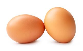 Side view of two fresh brown chicken eggs in stack isolated on white background with clipping path photo