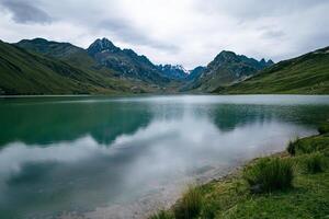 Serene reflection of a mountain lake in Peru. photo