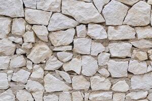 Stone fence wall texture, panoramic garden stonewall, limestone dolomite white slate slab rock texture. abstract background photo