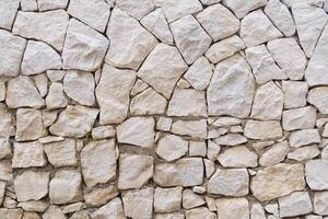 Stone fence wall texture, panoramic garden stonewall, limestone dolomite white slate slab rock texture. abstract background photo