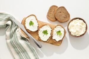 Sandwiches with Philadelphia cheese on a light background. photo