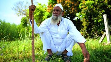 Ageing Man in Traditional Attire Coughing video