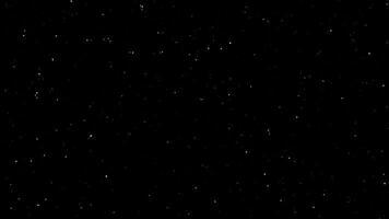 Loop falling glow green dust particles on black abstract background video