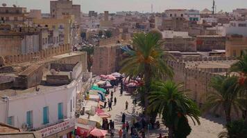 View of old medina in Sousse in Tunisia crowded with lots of people. video