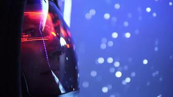 Astronaut in reflective helmet observes moving particles in space. astronaut studies cosmic motion, surrounded by silent vastness. Astronaut remains focused on universe. Concept space exploration video