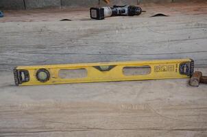 Level Meter Lying On Floor, Construction Tool For Leveling. High quality photo