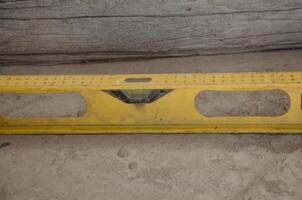Level Meter Lying On Floor, Construction Tool For Leveling. High quality photo