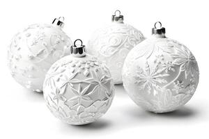 set of four white Christmas balls, each with a unique raised pattern. isolated on white background. The design contains floral motifs and snowflakes photo
