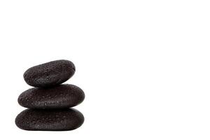 Stack of wet black spa stones photo