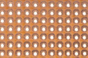 Close up of copper prototyping PCB surface photo