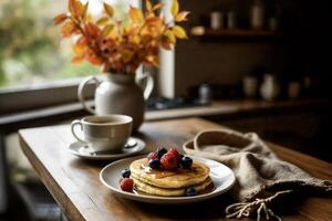 Cozy autumn breakfast with pancakes and fresh berries photo