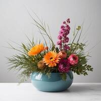 cut flower floral design, abstract style, vivid but muted color, low wide container photo