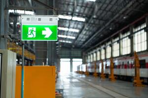Emergency exit sign on the platform of the railway repair station. photo