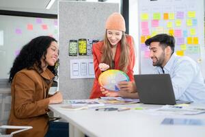 Multiethnic young business people working together in modern office, Collaborate to designing an application for use on the internet network. photo