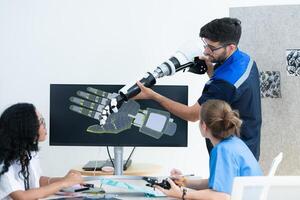 Engineers, doctors and physical therapists brainstorm ideas to design a robot with arm and hand organs, To be utilized for additional testing on patients. photo