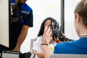 Engineers, doctors and physical therapists brainstorm ideas to design a robot with arm and hand organs, To be utilized for additional testing on patients. photo