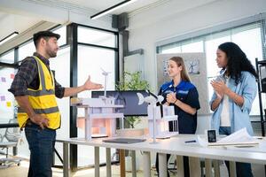 Engineers, architects, and designers collaborate to design a building that employs natural energy. photo