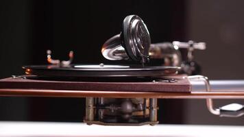 Vintage gramophone playing music with shiny needle on vinyl record video