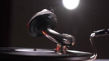 Vintage gramophone playing a vinyl record with warm lighting video
