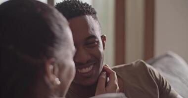 Ethnic woman caressing man and speaking video