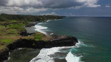 View of the famous Golden beach between black volcanic rocks on the banks of the Gris-Gris river, Mauritius. La Roche qui pleure video