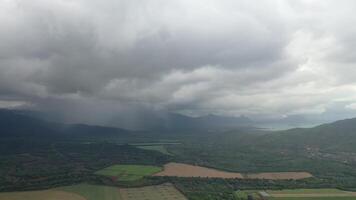 top view of rural fields and rain in the distance, Mauritius video