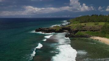 View of the famous Golden beach between black volcanic rocks on the banks of the Gris-Gris river, Mauritius. La Roche qui pleure video