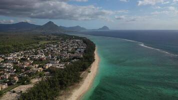 bird's eye view of a suburb with a beautiful white beach on the island of Mauritius video