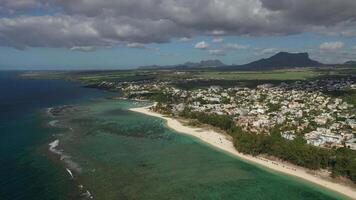 bird's eye view of a suburb with a beautiful white beach on the island of Mauritius video
