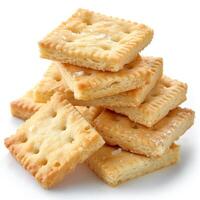 A stack of salty crackers on a white background, highlighting their golden color and crispy texture. photo