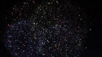 A vibrant display of colorful sparkling stars and particles against a deep black background, resembling a mesmerizing fireworks or galaxy scene. video