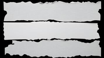 White ripped paper strips with torn edges isolated on a black background, perfect for design overlays photo