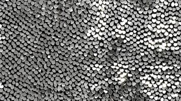 Elegant silver sequins arranged in an abstract pattern, creating a sparkling backdrop for fashion or celebratio photo