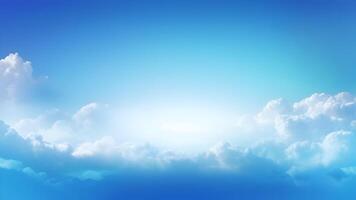 Blurry blue sky with soft, hazy clouds creating a smooth gradient, perfect for backgrounds with copy space. photo