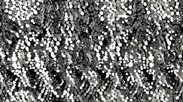 Elegant silver sequins arranged in an abstract pattern, creating a sparkling backdrop for fashion or celebratio photo