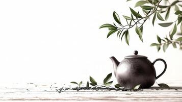 Elegant Teapot with Tea Leaves Isolated on White Background photo