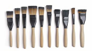 Set of Isolated Paint Brushes with Wooden Handles on White Background photo