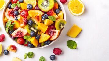 Fresh Fruit Salad in Bowl with Colorful Assortment of Ingredients photo