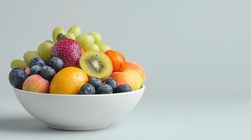Fresh Mixed Fruit Bowl Isolated on Light Background for Healthy Eating photo