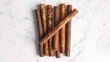 Cinnamon Sticks Isolated on White Background for Culinary Use photo