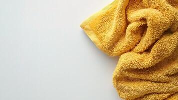 Soft Yellow Towel Folded on a Clean White Background photo