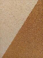 A close up of a brown and white wall photo