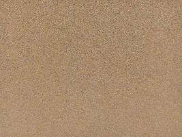 A brown surface with a few small spots photo